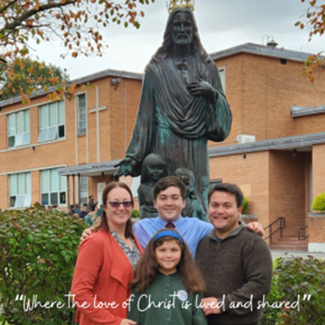 family with the Jesus statue with "Where the love of Christ is lived and shared"