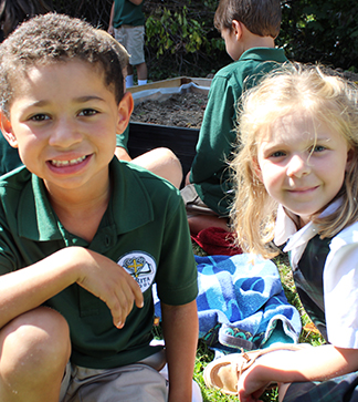 Happy kindergarten students outside posing for a picture