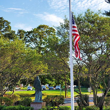Outside view of St. Rita School with U.S. flag